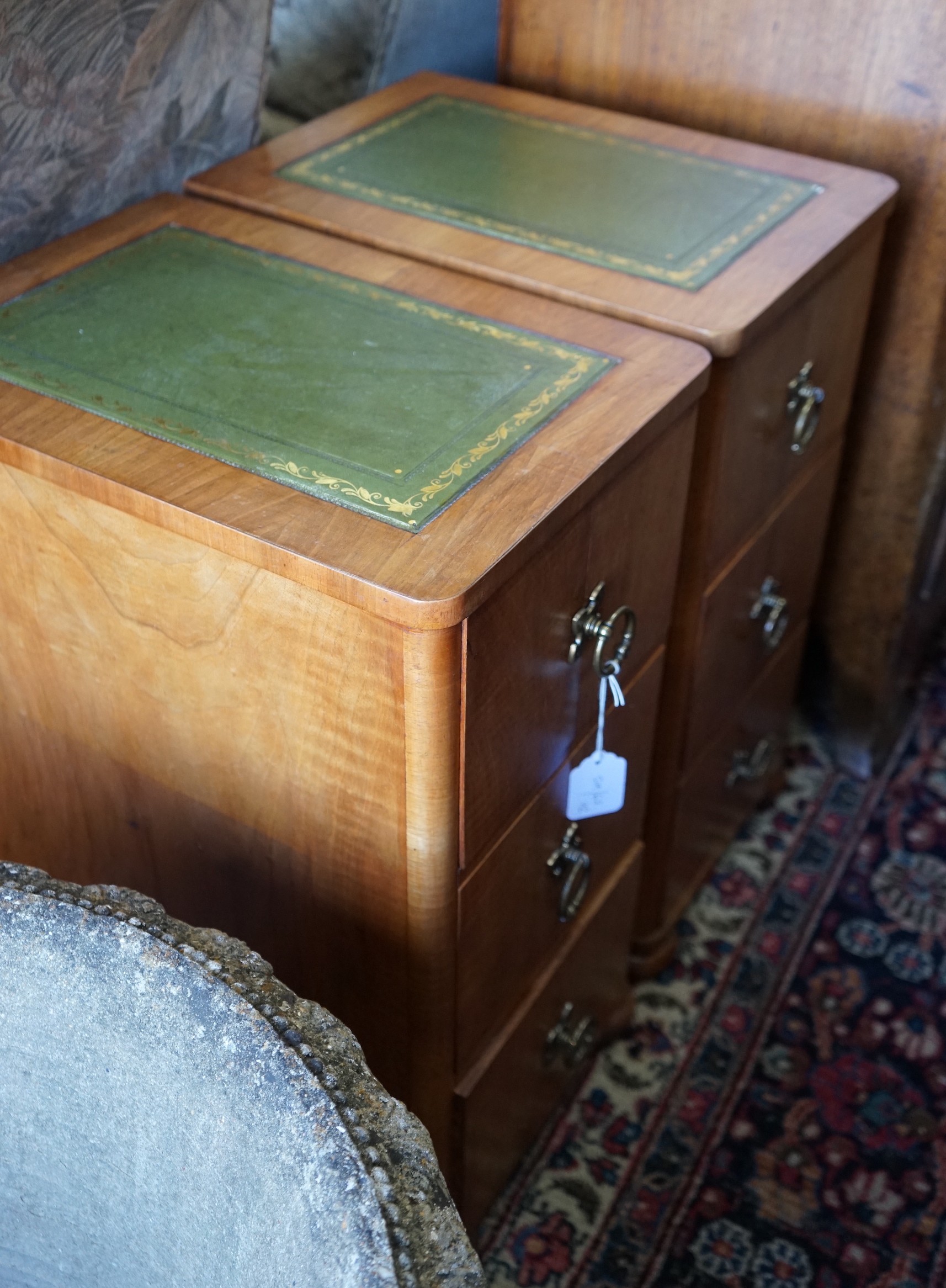 A pair of modern mahogany three drawer bedside chests, width 30cm, depth 44cm, height 63cm